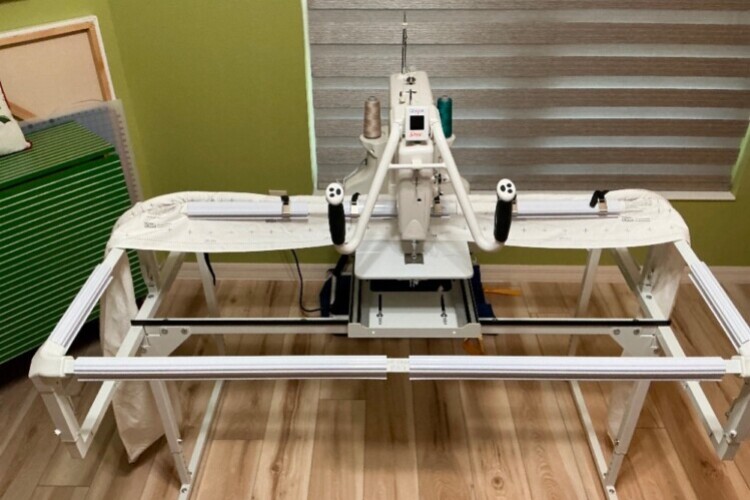 Frame adjustable for sewing standing or sitting